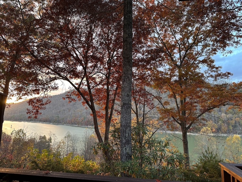 Watauga Lake and the Appalachian mountains seen from the lake house deck in fall.