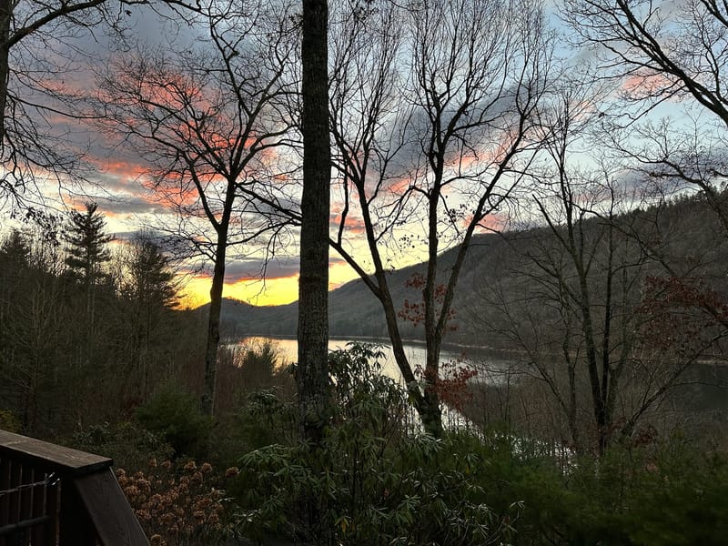 Pink and orange spring sunset over Watauga Lake from the lake house deck.